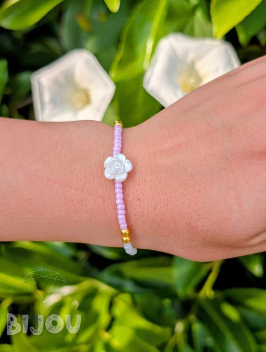 Lilac seed beads with mother-of-pearl flower charm